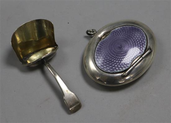 A George V silver and lavender enamel powder compact and a George III silver scuttle caddy spoon,